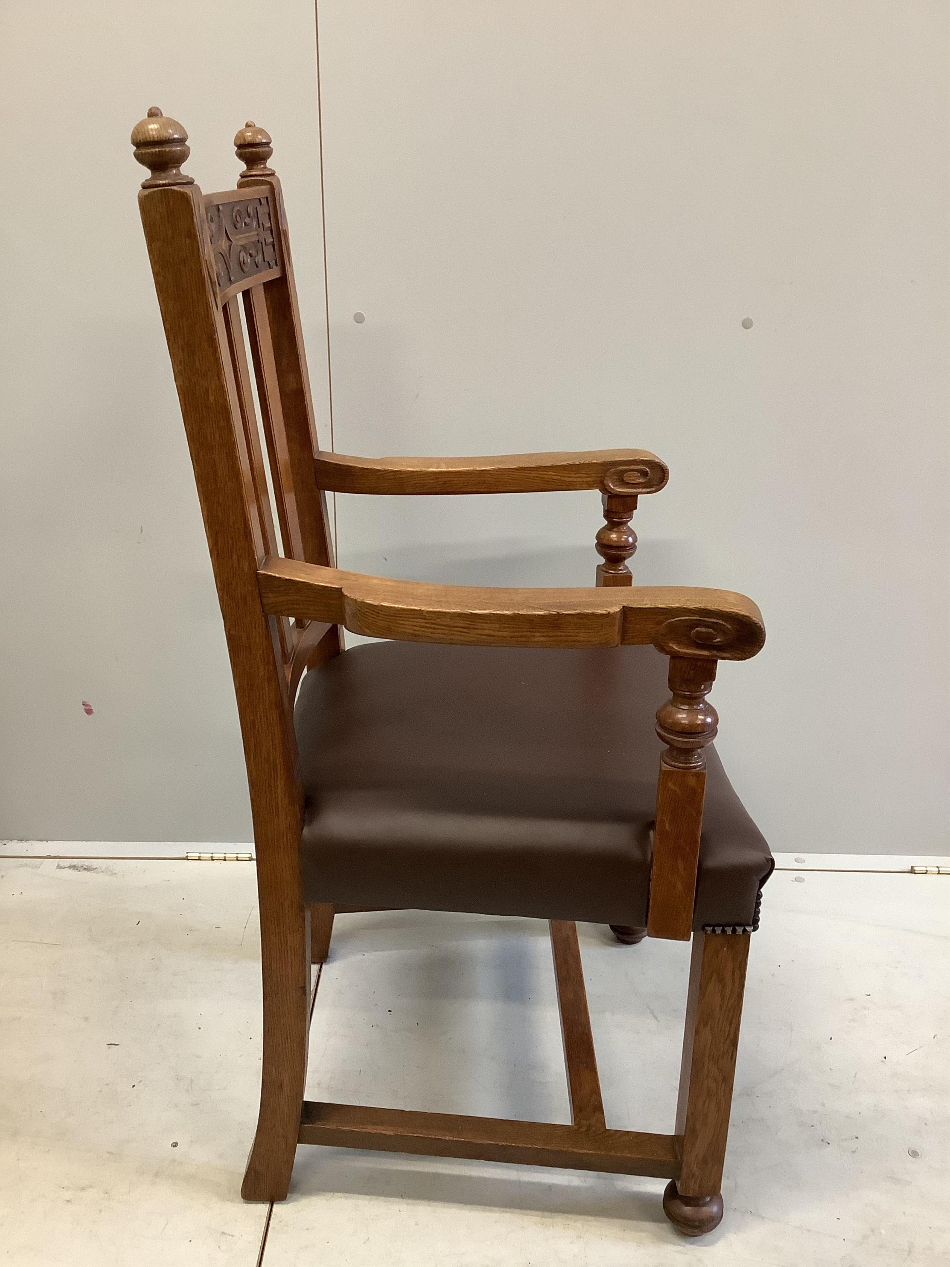 A set of eight early 20th century carved oak dining chairs, two with arms. Condition - fair to good